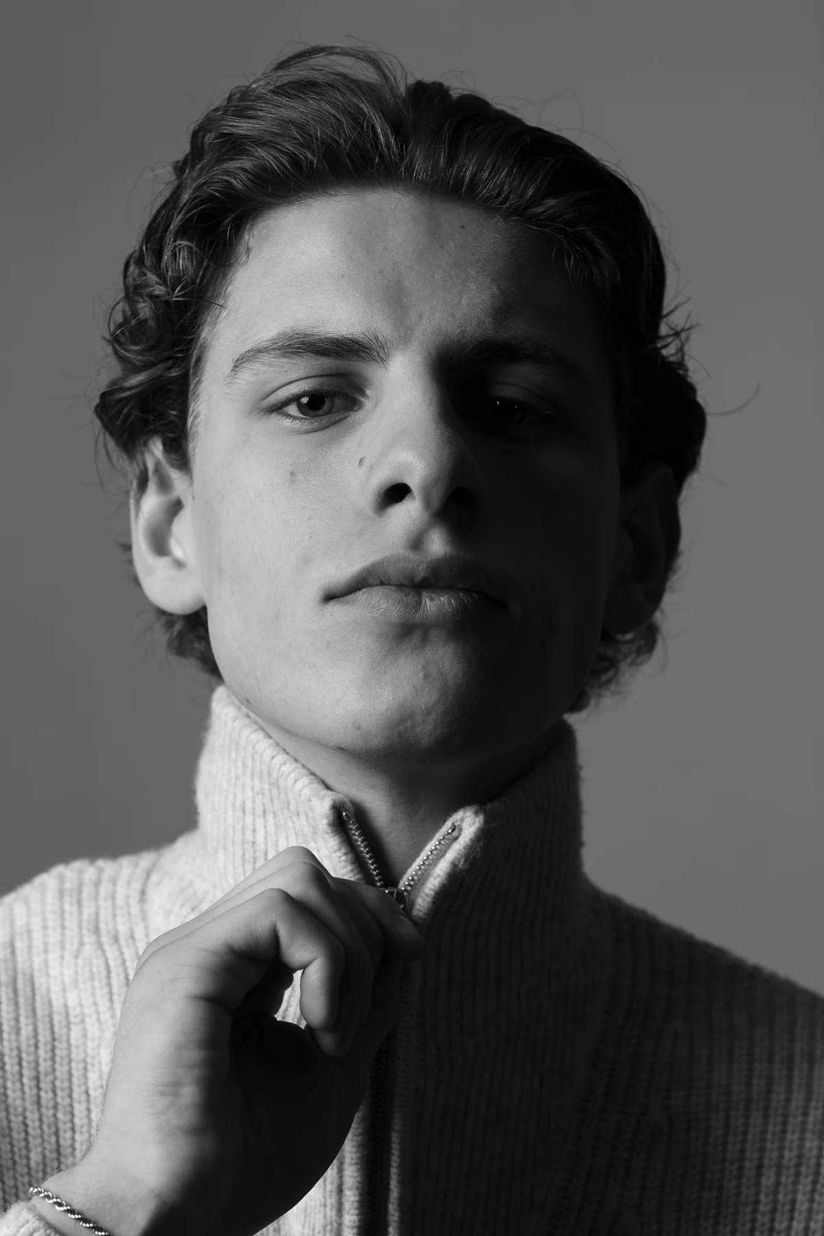 Black-and-white portrait with a zipper